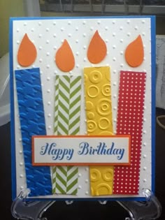 a birthday card with candles on it