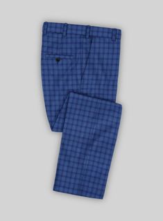 If you're on the hunt for pants that will serve you well for every event, our Reda Havelock Blue Checks Wool Pants are a perfect choice. Crafted from pure wool, our pants maintain a distinguished appearance to every man's preferences. Additionally, the vibrant blue checks add versatility to your wardrobe, enabling you to dress up or down for any occasion by mixing and matching.  Look Includes    Reda Havelock Blue Checks Wool  Fabric  Cross Pocket  Flat Front  Two Welted Back Pockets on Trousers Tailored Blue Wool Pants, Tailored Blue Wool Bottoms, Tailored Wool Blue Bottoms, Tailored Blue Wool Dress Pants, Fitted Wool Blue Dress Pants, Fitted Blue Wool Dress Pants, Fitted Wool Dress Pants In Blue, Blue Suits With Welt Pockets And Tapered Legs, Formal Blue Wool Bottoms