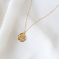 "A simple gold coin with an abstract filigree pattern. Model is wearing the 18 inches. MEASUREMENTS AND MATERIALS: Materials: 14K gold filled chain. 14K gold plated coin. COMPLETE THE LOOK: https://www.etsy.com/listing/738818173/rose-quartz-necklace-rose-quartz-pendant --------------------♥ PROMOS ♥-------------------- Want 10% off? Join the mailing list by visiting http://bit.ly/vedern . --------------------♥ BUY WITH CONFIDENCE ♥-------------------- Don't love it? Message me to set up a return Dainty Engraved Round Pendant Coin Necklace, Elegant Gold Coin Necklace Nickel Free, Nickel-free Yellow Gold Medallion Coin Necklace, Gold Coin Necklace With Adjustable Chain And Round Pendant, Gift Medallion Coin Necklace With Adjustable Chain, Dainty Coin Medallion Necklace Gift, Handmade Gold Round Disc Jewelry, Gold Plated Coin Necklace With Adjustable Chain, Gold Engraved Round Pendant Coin Necklace