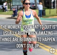 a woman running down the road with a quote on her side that reads, the moment you want to quit is usually right when amazing things are beginning to happen