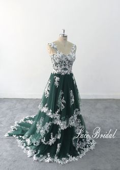 This is a customized product, please provide measurement and phone number when ordering. Thank you Lace Wedding Dress, A-line Dark green Tulle Lace Wedding Dress, Elegant Wedding Gown, Boho Wedding Gown with Corset Top 1.As always, Custom Made(your own size, your preferred color). 2.I carefully select high-quality beads, pearls, fabrics and threads to create every dress. 3.For this style, I need: 【Information required to place an order】 Color: 【Dark green tulle + ivory lace]】 Height: Bust: Waist Military Green Wedding Dress, White Dress With Green Accessories, White And Emerald Wedding Dress, Wedding Dress White And Green, Wedding Dress With Green Accent, Green A-line Wedding Dress, Green Ball Gown With Sweetheart Neckline For Prom, Green Fitted Ball Gown For Debutante Ball, Green Ball Gown For Debutante Ball