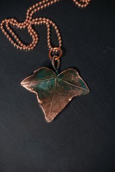 Copper jewelry pendant ivy leaf with a turquoise patina for a | Etsy Copper Flower Pendant Necklace As Gift, Green Patina Pendant Jewelry, Green Pendant Jewelry With Patina, Elegant Patina Pendant Necklace, Elegant Pendant Necklace With Patina, Bronze Copper Necklace With Patina, Turquoise Necklace With Patina For Gifts, Bronze Patina Copper Necklace, Bronze Pendant Jewelry With Patina