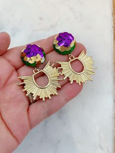 "Gorgeous Mardi Gras stud earrings with a purple, green and gold sequined stud and a beautiful gold sunburst! Nickel free posts. These stunning earrings measure approximately 2-2.5\". Giftbox included!" Mardi Gras Krewe, Mardi Gras Earrings, Mardi Gras Jewelry, Gold Sunburst, Bridal Party Jewelry, Gray Earrings, Polymer Earrings, Gold Statement Earrings, Jewelry Card