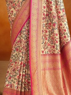 Introducing our outstanding beige kalamkari printed banarasi silk saree with blouse! Made with high-quality banarasi silk material, this saree exudes elegance and sophistication. The beige color adds a touch of grace, while the kalamkari printed work creates a mesmerizing ensemble. The rich pallu with zari weaving border enhances the overall look, making it a perfect choice for weddings, festivals, and other special occasions.
The accompanying pink color banarasi silk fabric blouse complements t Diwali Beige Traditional Drape Blouse Piece, Bollywood Style Beige Saree Blouse Piece, Cream Self Design Saree, Diwali Beige Saree Blouse Piece, Cream Self-design Saree, Elegant Multicolor Saree With Kalamkari Print, Elegant Multicolor Kalamkari Print Saree, Unstitched Beige Bollywood Saree, Elegant Multicolor Kalamkari Saree