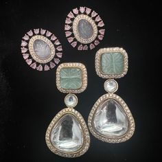 This beautiful earrings set has an excellent finish and gives out an exquisite sense of style. If you are looking for an amazing Fashion Jewelry set for special occasions such as Anniversary, Engagement, Party, Wedding, or for gifting, then your search ends here. Handmade Indian Temple Jewelry, best to wear it for traditional ceremonies or Indian wedding. This bridal jewelry has an ethnic finish. It has Cubic Zircon stones with semi-precious ruby and emeralds. It is a Bollywood style one gram jewelry. There are long and short patterns of Indian jewelry in Kundan, Pearls, CZ, American Diamond, ruby, emerald, Polki, kemp to suit every occasion of South Indian and North Indian weddings.   Color, shades, texture displayed may slightly vary from the actual product due to digital image limitatio Elegant Party Earrings With Stones, Party Gemstone Drop Bridal Earrings, Silver Wedding Earrings With Stones, Gemstone Drop Bridal Earrings For Party, Party Bridal Drop Earrings With Gemstones, Dangle Stone Earrings For Wedding, Dangle Earrings With Stones For Wedding, Elegant Crystal Earrings With Stones As Gift, Party Jewelry Sets With Matching Drop Earrings