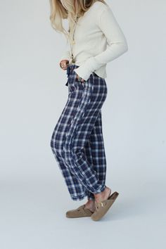 Introducing the Prairie Plaid Pants - the perfect pants for adding a touch of bohemian style to your wardrobe without sacrificing the comfort! Comfortable, mineral washed fabric with plaid pattern detailing Relaxed and loose wide leg silhouette Classic elastic waistband with adjustable ribbon for flattering fit Convenient side pockets (we love pockets!) Curved hem for added style and movement Pair with: High Neck Racerback Brami, Cozy Cabin Turtleneck Poncho and Gizelle Necklace. *Due to lightin Relaxed Fit Cotton Plaid Pants, Plaid Cotton Bottoms With Elastic Waistband, Spring Plaid Loungewear Pants, Casual Plaid Bottoms With Elastic Waistband, Casual Plaid Bottoms With Relaxed Fit, Fall Harem Pants For Loungewear, Straight Leg, Plaid Bottoms With Elastic Waistband For Loungewear, Fall Straight Leg Harem Pants For Loungewear, Relaxed Fit Plaid Pants With Elastic Waistband