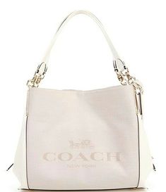 Offered is a beautiful and classy Coach Dalton Shoulder Bag in Chalk.  This stunning bag has a double strap with a strap drop of 9 3/4 inches.  The lovely chalk color leather has a woven pattern on the front and back and refined calf leather on the sides and straps.  The front of the bag has the Coach logo woven into the fabric.  (Please note a small mark on the front upper left corner of the bag.  See photo #11).  The bag is approximately 13 1/2 inches wide, 10 3/4 inches high and 5 1/2 inches Horse And Carriage, Coach Logo, Horse Carriage, Coach New York, Coach Bag, Fabric Bag, Dillard's, Rebecca Minkoff Hobo, Coach Bags