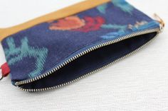 The perfect sized clutch purse to carry your phone, cash, cards, lip balm, keys and more. The zipper closure will keep your items safe and secure, yet easy for you to access!    Product features:- one of a kind- made from upcycled materials - fully lined- metal loop tab for easy attaching to other bags/belts- concealed French seams- durable finish  Size:7" - 4.5" Care instructions:Gentle machine or hand wash recommended when needed.  Please note: pattern placement of fabric may change. These clu Bohemian Style Pouch Coin Purse For Everyday, Bohemian Zipper Pouch Clutch For Daily Use, Bohemian Coin Purse For Everyday Use, Bohemian Clutch With Zipper Pouch For Daily Use, Bohemian Pouch Coin Purse, Bohemian Pouch Wallet For Everyday Use, Blue Bohemian Pouch For Everyday Use, Bohemian Clutch Pouch For Daily Use, Bohemian Cosmetic Bag With Zipper, Rectangular Shape