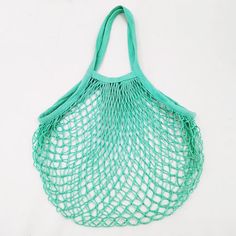 a green net bag on a white background