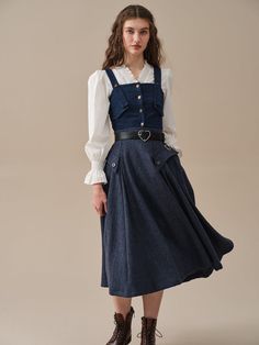 Imagine strolling through a meadow, the soft wool gently swaying with each step. The skirt's graceful silhouette and delicate pattern evoke a sense of romance, transporting you back to a bygone era of refined charm.The premium wool material ensures you'll feel luxurious and warm, perfect for tackling those trans-season Workwear Dress With Voluminous Skirt, Elegant Winter Dress With Flared Skirt, Classic Long Lined Dress, Fall Dresses With Voluminous Long Skirt, Classic Long Dress With Lined Skirt, Fall Tiered Lined Skirt Dress, Fall Tiered Skirt Dress With Lining, Long Lined Skirt Dress For Fall, Flowy Ruffled Skirt Dress For Fall