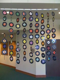 a room with many circular objects hanging on the wall