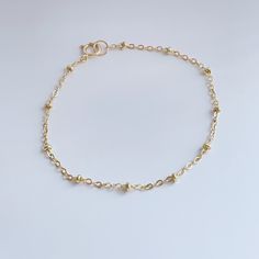 Rock everyday your satellite chain bracelet, all made with 14K gold fill that’s water resistant. Measures: 6 inch +1 in extension chain Dainty Yellow Gold Beaded Bracelets In 14k Gold Filled, Minimalist 14k Gold Chain Bracelet With Extender, Minimalist 14k Gold Charm Bracelet With Delicate Chain, 14k Gold Filled Beaded Chain Bracelets As Gift, Dainty 14k Gold Bracelet With Extender, Delicate Chain Bracelet With Extender, 14k Gold-filled Adjustable Chain Charm Bracelet, Dainty Gold Charm Bracelet With Adjustable Chain, Gold Beaded Chain Bracelet In 14k Gold Filled