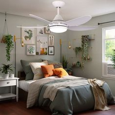 a bed room with a neatly made bed and a ceiling fan