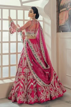 Embellished Shocking Pink Lehenga Choli for Bridal Wear comes in embellished work of zardozi, Mukesh, and Resham on every inch of this Shocking Pink lehenga choli. The fabric used for this lehenga choli is raw silk. Net embellished dupatta is paired with this lehenga choli.SKU: LN49 Fuschia Pink Bridal Lehenga, Fuschia Pink Lehenga, Lehnga Designs For Bridal, Pink Lehnga Outfit Wedding, Pink Bridal Lehenga Brides, Bridal Choli Designs Indian Weddings, Magenta Pink Bridal Lehenga, Shocking Pink Lehenga, Pink Lengha Bridal