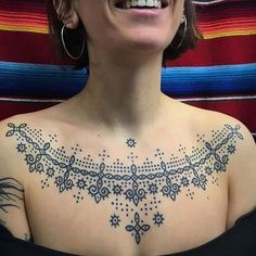 a woman with a tattoo on her chest