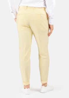 Crafted with a vibrant, cream yellow stretch cotton, these custom made pants are uniquely stylish and supremely comfortable, and will become a go to favorite when you're looking to stand out. Chic Fitted Cotton Chinos, Chic Yellow Cotton Pants, Cream Stretch Cotton Pants, Stretch Cotton Cream Pants, Fitted Cream Cotton Pants, Chic Fitted Mustard Pants, Chic Yellow Tapered Leg Pants, Chic Yellow Tapered Pants, Elegant Fitted Yellow Bottoms