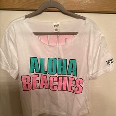 Woman’s Victoria Secret (Pink) Rare “Aloha Beaches” Shirt Brand New-Never Worn When Ordered Came In Bag- No Tags Backside Reads: “Love Pink” Pink Hawaiian T-shirt For Vacation, Pink Hawaiian Top For Vacation, Pink Hawaiian Vacation Tops, Pink Hawaiian Beach Top, Casual Pink Top For Vacation, Pink Sporty Tops For Beach Season, Sporty Pink Tops For Beach Season, Pink Hawaiian T-shirt For The Beach, Pink Tropical Print Tops For Vacation