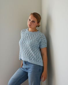 Italian cotton light blue summer short sleeve top. Hand made shimmering top perfect for warm summer weather. Casual Pointelle Knit T-shirt For Summer, Short Sleeve Pointelle Knit Top, Relaxed Fit Short Sleeve Pointelle Knit Top, Summer Pointelle Knit Short Sleeve Tops, Pointelle Knit Short Sleeve Tops For Summer, Summer Short Sleeve Pointelle Knit Tops, Blue Cotton Short Sleeve Knit Top, Blue Cotton Knit Top With Short Sleeves, Blue Short Sleeve Cotton Knit Top