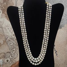 Enhance your style with this Three-Strand Pearl Necklace, featuring lustrous pearls in a classic layered design. Ideal for both formal and everyday wear, this piece adds a touch of timeless elegance to any ensemble. Material : Natural pearls & adjustable thread