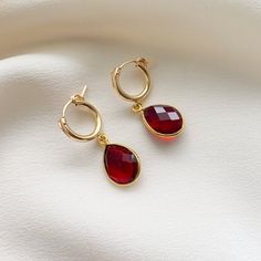 Simple and sweet, these hoop earrings feature small pear-shaped gemstone charms that are faceted on both sides. We've got gemstones for every month of the year. -- charms: 18mm 14k Gold Filled hoop diameter: 13mm secure latch back closure bezel frame: 22k gold plated sterling silver available gemstones: 12 hydrothermal quartz stones Note: moonstone - natural gemstone Faceted Briolette Teardrop Earrings, Gold Faceted Teardrop Hoop Earrings, Yellow Gold Teardrop Earrings With Charms, Elegant Hoop Earrings With Charms As Gift, Gold Teardrop Earrings With Charms, Gold Teardrop Hoop Earrings With Birthstone, Faceted Teardrop Dangle Earrings As Gift, Faceted Teardrop Dangle Earrings For Gift, 14k Gold Filled Teardrop Hoop Earrings For Anniversary