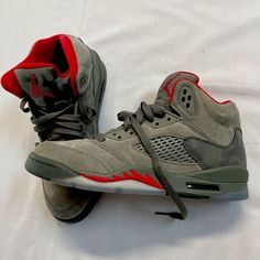 This Is A Unworn Pair Of Jordan 5 Retro Camo P51 Sz Y7. No Original Box But In Perfect Condition. These Feature Dark Stucco Suede Upper With Camo Accents And An Icy Blue Translucent Sole. See Pictures And Feel Free To Ask Any Questions. These Were A Thrift Store Find So Can’t Say Whether They Are Reps Or Authentic But I Do Consider Myself A Sneakerhead And These Look And Feel Perfect. These Resell On Goat & Stock X For $300+. Nike, Jordan, Stussy, Carhartt, Kicks, Yeezy, Adidas Casual High-top Jordan Shoes For Outdoor, Custom Cushioned Sneakers For Sports, Casual Jordan Shoes, Casual Gray Jordan Shoes, Jordan 23, Jordan 5, Kids Jordans, Icy Blue, Thrift Store Finds