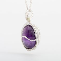 This "Murazaki" pendant necklace is handmade of 999 fine silver. It has been hand crafted in pure 99.9% solid silver in my workshop. It features a translucent Amethyst gemstone. "Murazaki" means "purple" in japanese. NOTE: This piece of jewelry has been created around this one-of-kind gemstone. It is unique and cannot be reproduced. Only one available! Artisan Sterling Silver Purple Jewelry, Purple Artisan Sterling Silver Jewelry, Artisan Purple Sterling Silver Jewelry, Artisan Necklace With Polished Round Pendant, Artisan Sterling Silver Jewelry In Purple, Artisan Necklace With Round Pendant And Polished Finish, Artisan Polished Round Pendant Necklace, Artisan Round Pendant Necklace With Polished Finish, Sterling Silver Jewelry With Large Healing Pendant