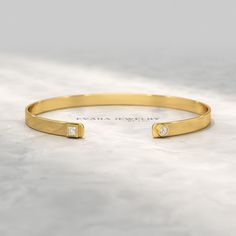 Indulge in timeless elegance with our exquisite Diamond Solitaire Cuff Bracelet. Crafted from radiant 10K, 14K, or 18K solid gold, this cuff exudes sophistication. Its shimmering lab-grown diamond, meticulously set in a prong setting, captivates with its brilliance. Wear it as a statement piece or a cherished keepsake, this custom cuff bangle bracelet is a testament to your impeccable taste. 𝐅𝐞𝐚𝐭𝐮𝐫𝐞𝐬: * 𝐌𝐚𝐝𝐞 𝐭𝐨 𝐎𝐫𝐝𝐞𝐫 * 𝐌𝐞𝐭𝐚𝐥: 𝟏𝟎𝐊 𝐆𝐨𝐥𝐝 | 𝟏𝟒𝐊 𝐆𝐨𝐥𝐝 | 𝟏𝟖𝐊 𝐆? Timeless Gold Cuff Bracelet For Wedding, Adjustable Classic Gold Bracelet For Anniversary, Elegant 14k Gold Bangle With Single Diamond, Elegant Gold Cuff Bracelet With Jubilee Detail, Classic Yellow Gold Bangle With Single Diamond, Yellow Gold Cuff Jewelry For Anniversary, Timeless Formal Bangle With Single Diamond, Classic Bangle With Single Diamond For Anniversary, Elegant 14k Gold Bangle For Anniversary