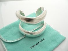 Overview:Offered for sale is a wonderful, super cool, and gorgeous Tiffany & Co Silver Peretti Double Open Cuff / Bracelet. Definitely a Tiffany piece that you will get your money's value for. It works perfectly with pretty much any attire your put on, AND is the perfect Tiffany statement piece. It is the perfect piece that fits a lifestyle on the go -- the cuff can be worn to pretty much any occasion! It is simple, elegant, and classic all rolled into one bracelet - it looks awesome worn al