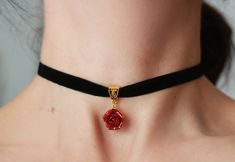 "Black velvet ribbon choker with sculpted ruby-red sparkle rose. Material of rose is polymer clay with special cover Each petal of flower made by hand Dia flower about 15 mm/ 0.55 \" Length of necklace is adjustable: 10-12 inches/ 25,4 - 30,5 cm 11-13 inches/ 28-33 cm 12-14 inches/ 30.5- 35.5 cm 13-15 inches/ 33-38 cm 14-16 inches/ 35.5 cm-40.5 cm 15-17 inches/ 38,1 cm- 43,2 cm 16-18 inches/ 40.6 cm- 45.7 cm 17-19 inches/ 43 cm - 48 cm 18-20 inches/ 45,5- 50.8 cm Width of ribbon 10 mm / 0.4 inch Elegant Rose Design Choker, Rose Red Jewelry With Rose Design For Party, Party Jewelry With Rose Design In Rose Red, Elegant Rose Design Jewelry Choker, Elegant Rose Design Choker Jewelry, Valentine's Day Rose Design Party Jewelry, Elegant Adjustable Rose Design Choker, Elegant Adjustable Rose Red Jewelry, Elegant Rose Design Choker As Gift