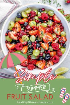 a bowl full of fruit salad with an umbrella over it and the words simple summer fruits salad