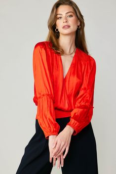 This billowy blouse features an elegant surplice neckline and gently puffed sleeves with pleated paneling. Smocked detailing accents the shoulders and draws in the waist, creating a defined silhouette. •Surplice neckline •Long sleeves with pleating •Elasticized cuffs •Smocked at shoulders & waist item number 2330276 100% Polyester Billowy Blouse, Surplice Neckline, Woven Top, Puffed Sleeves, Item Number, Smocking, Puff Sleeve, Long Sleeves, Long Sleeve