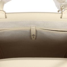 This 2024 Limited Edition Bellechasse Biaude PM bag is of sand Goyardine coated canvas and sand chevroches calfskin leather with palladium hardware, featuring two sand flat leather top handles and trim, a removable closure clip, and tonal stitching.The interior is lined in white natural canvas and has one interior floating pocket on the front wall.Origin: FranceCondition: New and never worn (plastic on handles)Accompanied by: Dustbag, closure clip and carebookMeasurements: 10.6" x 5.9" x 14.1"; Luxury Neutral Bags, Beige Top Handle Bag In Coated Canvas, Luxury Beige Coated Canvas Shoulder Bag, Beige Epsom Leather Bag With Detachable Strap, Luxury Neutral Top Handle Shoulder Bag, Luxury Neutral Leather Shoulder Bag, Beige Textured Leather Top Handle Satchel, Designer Cream Shoulder Bag For Business, Classic Beige Epsom Leather Shoulder Bag