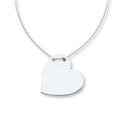 Simply captivating, this contemporary necklace for her features a heart of 14K white gold, threaded through the top with an adjustable 16- to 18-inch cable chain. The necklace secures with a lobster clasp. Modern White Necklace With Cable Chain, Modern Sterling Silver Heart Necklace, Modern Heart-shaped Sterling Silver Necklace, Modern White Gold Heart-shaped Jewelry, Modern Heart-shaped White Gold Jewelry, Modern Necklaces For Anniversary On Valentine's Day, Modern Heart Charm Necklace As Gift, Modern Necklaces For Valentine's Day Anniversary, Modern Heart Charm Necklace Gift