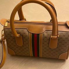 Gucci Vintage Handbag Never Used With Bag. Gucci Shoulder Satchel, Gucci Top Handle Shoulder Bag, Gucci Satchel With Detachable Strap And Double Handle, Gucci Satchel With Dust Bag Included, Gucci Crossbody Satchel With Top Carry Handle, Gucci Crossbody Satchel, Gucci Shoulder Bag Satchel For Shopping, Gucci Bag With Gold-tone Hardware And Top Handle, Gucci Double Handle Bag With Top Carry Handle