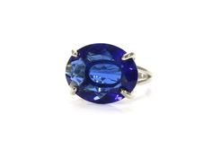 >Crafted in 14k gold-fill, this gorgeous and vibrant cocktail ring exudes elegant vibrance with its large, oval Sapphire stone. A large ring that will stylishly go with your looks, both casual and for special occasions. A statement jewelry and an awesome gift choice for a special lady. ☛ 𝒜𝐵𝒞 - Add Engraving - https://etsy.me/2ZSRjhu ☛ Ring size - Select the size you would like from the drop down menu ♥ Gemstone Type - Sapphire (Lab Created) ♥ Gemstone Size - 16x20mm ♥ Gemstone Cut - Facete Oval Gemstone Rings For Party, Oval Gemstone Party Rings, Oval Fine Jewelry Rings For Party, Oval Party Ring With Center Stone, Elegant Oval Crystal Ring For Parties, Elegant Oval Sapphire Ring With Vs Clarity, Modern Oval Birthstone Ring For Formal Occasions, Elegant Oval Crystal Ring With Polished Finish, Modern Oval Crystal Ring For Anniversary