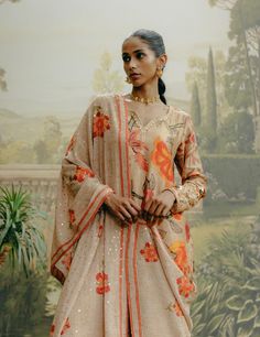 Showcase sophistication in a biscuit printed kali pant paired with a mix print embroidered kurta in dupion silk. Complete the look with a sequined georgette dupatta for a touch of glamour and elegance. Wedding Sharara With Printed Motifs, Wedding Sharara With Printed Motifs In Georgette, Bollywood Tussar Silk Sets With Mirror Work, Tussar Silk Palazzo Set With Sheer Dupatta, Tussar Silk Palazzo Set With Dupatta For Eid, Traditional Drape Palazzo Set With Printed Motifs, Wedding Sharara With Printed Motifs And Straight Kurta, Sharara With Printed Motifs And Straight Kurta For Wedding, Printed Motif Sharara With Straight Kurta For Wedding