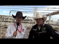 two men in cowboy hats standing next to each other