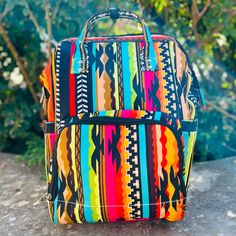 The Aztec Warrior Diaper Bag is very roomy and bright and beautiful. This bag has multiple zipper pockets and cubbies to put necessities. 13" L X 8" W Multicolor Bags With Zipper Pocket For Trips, Multicolor Travel Diaper Bag Rectangular, Multicolor Rectangular Travel Diaper Bag, Multicolor Bags With Zipper Closure For Trip, Multicolor Backpack Shoulder Bag For Outdoor, Multicolor Rectangular Shoulder Bag For Outdoor, Multicolor Backpack With Zipper Pocket For Everyday Use, Large Capacity Multicolor Shoulder Bag For Outdoor, Multicolor Tote Bag For Outdoor