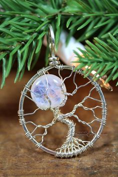 Rainbow Moonstone Eco Friendly Tree of Life Pendant Recycled Argentium Sterling Silver Necklace Cele Handmade Moon-shaped Spiritual Jewelry, Handmade Artisan Moon-shaped Jewelry, Nature-inspired Moonstone Pendant Jewelry, Unique Tree Of Life Round Pendant Jewelry, Nature-inspired Moonstone Jewelry With Natural Stones, Artisan Silver Jewelry With Moon Charm, Nature-inspired Moonstone Jewelry Gift, Nature-inspired Moonstone Jewelry For Healing, Healing Nature-inspired Moonstone Jewelry