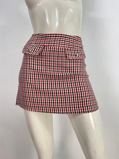 "Mini skirt, plaid mini skirt, united colors of Benetton, micro mini skirt, 23\"-24\" waist  Measurements:  Waist 11.5\"-12\"/hip 16.5\"-17\"/length 13.5\" Mannequin measurements:  5'8\", bust 34\", waist 25\", hip 33\" Please note that vintage clothing sizes can vary greatly.  The Measurements provided  are approximate and are taken lying flat.  I suggest taking a similar garment from your wardrobe and measure it while lying flat.  This way you can compare measurements.  All of our pieces are g Fitted Plaid Mini Skort, Casual Fitted Gingham Skort, Casual Gingham Fitted Skort, Plaid Skirted Skort For School, School Fitted Plaid Mini Skirt, Fitted Plaid Mini Skirt In Preppy Style, Fitted Plaid Tennis Skirt For School, Fitted Plaid Skort For School, Plaid Skort For School