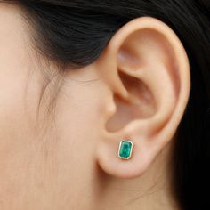 Product Details Enhance your cocktail party style with our stunning Solitaire Stud Earrings. Adorned with an Octagon Emerald, theyre perfect for formal attire. Shop now! Product Information SKU SHP-EARRINGS0621106457 Length 6.6 mm Width 4.6 mm Weight 0.96 gm (Approximate) EMERALD INFORMATION No.of Stones 2 Pieces Total Weight 1.32 Carat (Approximate) Dimension(approx) Emerald Cut-4X6 mm-2 Pcs Color Green Cut Brilliant Shape Emerald Cut Setting Type Bezel-Setting Quality Grade AAA View More Produ Yellow Gold Emerald Earrings With Bezel Setting, Cocktail Party Fashion, Cleaning Stone, Solitaire Studs, Signature Jewelry, Emerald Earrings, Timeless Jewelry, Party Style, Emerald Gemstone