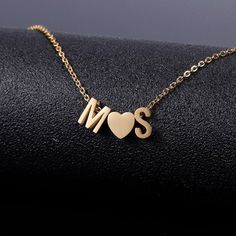 Personalized Initials Heart Necklace is the loveliest item in our jewelry collection. It is a special member of the custom initial necklace family. The necklace carries two letters and a lovely heart between them. It is a cute and playful jewelry item to celebrate the love inside your heart. We love the ones who celebrate the purest emotions. So we offer you a gold initial necklace, silver initial necklace, and rose gold initial necklace to suit all your customization color needs. This custom in Heart Initial Necklace, خواتم خطوبة, Couple Pendant, Initial Heart Necklace, Initial Letter Necklace, Unique Gifts For Dad, Necklace With Heart, Custom Initial Necklace, Silver Monogram