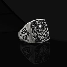 Custom Crest Signet Ring Coat Of Arms Ring Custom Rings For Men Silver Crest Signet Coat Of Arms Ring Men Unique Heraldic Family Crest Ring Made to Order Designs Details Metal: 925k Sterling Silver Weight:18-20 gram Color: Oxidized Silver Color ( color customizable ) Style: Family Crest / Coat Of Arms Dimensions : 0.7 x 0.7 inch Can be personalized  3D Style Handmade Design Contact us at this link freyjewelrydesign.etsy.com Personalized Engrave Service ● Design Silver Rings ● Custom Personalized Gift ● 925k Sterling Silver Material  ● Personalized Heraldic Ring ● Personalized Jewelry  ● Custom Engrave Ring ● Custom Engrave Ring ● Custom Family Crest Ring  ● Coat Of Arms Silver Ring  ● Signet Ring Man  ● Personalized Heraldic Ring  ● Unique Silver Rings For Man Custom Design Gift ● This Han Silver Heirloom Signet Ring Tarnish Resistant, Classic Coat Of Arms Collectible Rings, Classic Coat Of Arms Jewelry For Collectors, Classic Coat Of Arms Collectible Jewelry, Heirloom Silver Tarnish-resistant Signet Ring, Classic Sterling Silver Jewelry With Coat Of Arms, Vintage Silver Jewelry With Coat Of Arms, Formal Silver Rings With Coat Of Arms, Silver Signet Ring Mens