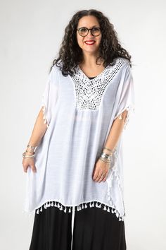 This flowy crochet cover up can be found at the crossroads of retro hippie fashion and cottagecore. With an intricate crocheted neckline and tassles to complement your every movement, this sheer coverup is the perfect companion for a trip to the beach or over a music festival outfit. Pair it with a funky pair of pants or a swimsuit and you're well on your way to the summer of love... what will you wear with yours? White Crochet Bohemian Cover-up, Bohemian Crochet Top With Lace Trim For Beach, Vacation Crochet Top With Lace Trim And Short Sleeves, Short Sleeve Crochet Top With Lace Trim For Vacation, Bohemian Beach Tops With Lace Trim, Bohemian Tops With Lace Trim For Beach, V-neck Cover-up With Lace Trim For Festival, V-neck Festival Cover-up With Lace Trim, V-neck Lace Trim Cover-up For Festival