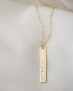 Perfect gift for your mom this Mother's day Have your mom's mom, grandma's or grandpa's signature on the pendant or any special signature. or have your kid's writing on the pendant Great Memorial gift for anyone. Custom Sterling silver // Gold filled handwriting signature vertical bar necklace. Have your special signature or handwriting on a necklace, - Name plate measures 5X30mm - 14K Gold filled or Sterling Silver PLEASE READ BELOW BEFORE PURCHASE --------------------------------------- ■ PERS Mother's Day Gift Rectangular Pendant Necklace For Mom, Minimalist Hand Stamped Necklaces For Anniversary Gift, Minimalist Hand Stamped Necklace For Anniversary Gift, Minimalist Jewelry With Engraving Option For Mother's Day, Minimalist Hand Stamped Necklace For Anniversary, Minimalist Name Necklace For Valentine's Day Gift, Minimalist Necklaces For Father's Day Personalized Gift, Father's Day Gift Necklace With Rectangular Pendant, Father's Day Gift Rectangular Pendant Necklace