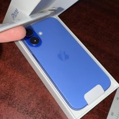 someone is opening up the new iphone 11 in their box and it's still in its package