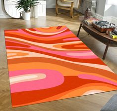 an orange and pink area rug in a living room