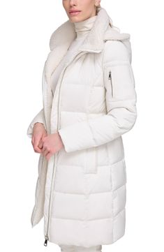 Wide quilted channels amp up the glamour of a hip-length puffer jacked filled with premium, lightweight down feathers. Removable hood Faux shearling lining Front zip closure Long sleeves Premium down fill 92% polyester, 8% spandex Machine wash, tumble dry Imported Model stats: 5'10" height, 32" bust, 25" waist, 36" hip. Model is wearing size small Winter White Quilted Puffer Jacket For Cold Weather, Quilted Winter White Puffer Jacket For Cold Weather, Winter White Quilted Nylon Outerwear, Quilted Nylon Outerwear In Winter White, Winter Nylon Puffer Jacket With Faux Fur Trim, Winter White Down Puffer Jacket For Spring, Nylon Puffer Jacket With Faux Fur Trim For Winter, Cold Weather Down Puffer Jacket With Faux Fur Trim, Fall Down Puffer Jacket With Faux Fur Lining