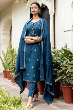 This is 3 piece set.It comes with mirror embellished kurta teamed with trouser and a dupatta to match. 3 Piece Set Fabric-Cotton Color-Navy Blue Work-Mirror embellished, embroidered & lace detailing with front & side tassels Kurta Detailing-Calf length kurta with side slits Bottom-Flared Sharara Sleeves-3/4th Sleeves Neck-Round Neck Occasion-Festive wear Washing care-Hand wash Navy Blue Mirror, Embellished Suit, Flared Sharara, Blue Mirror, Match 3, Blue Mirrors, Festive Wear, Suit Set, Embroidered Lace