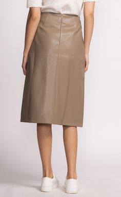 The Peyton Skirt is a chic mid-length faux leather piece that adds a touch of sophistication to any outfit. Style it with a tucked-in blouse and heels for a polished look! Material: 55% PU, 45% Polyester Tapered panel detail Back zip closure Model is wearing XS Vegan Leather Skirt, Pink Martini, Swimsuit With Shorts, Thick Heel, Swimsuit Dress, Leather Pieces, Dress Gift, Outfit Style, Sweater Sale